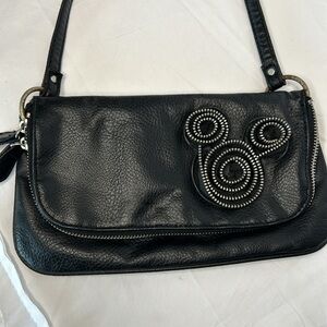 DISNEY PARKS black non leather small shoulder bag. Mickey Mouse design on front.